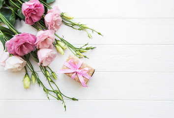 Fresh pink eustoma flowers and gift box © Olena Rudo