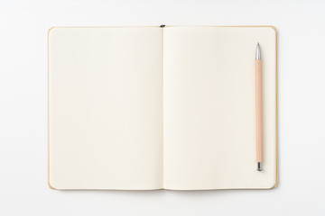 Top view of kraft paper notebook, page, pencil