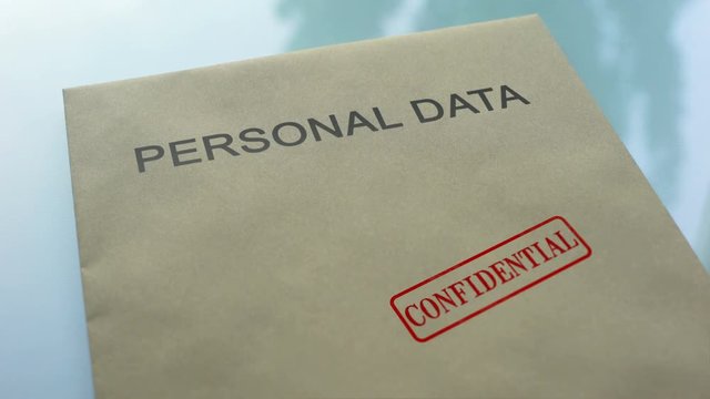 Personal data confidential, stamping seal on folder with important documents