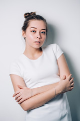 Obraz premium Portrait of a fashionable young woman on a white