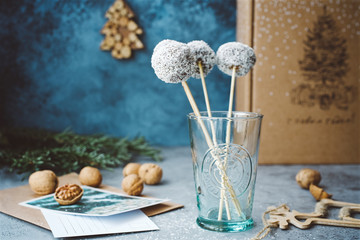  Homemade sweets on stick. Vegetarian sweets with cocoa, dates and coconut chips