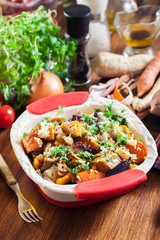 Roasted vegetables with rice in casserole dish