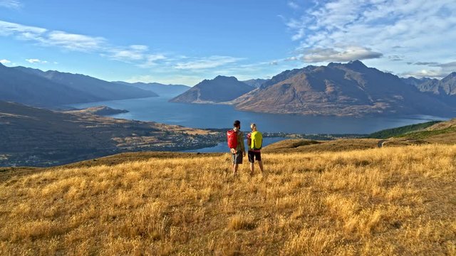 Aerial male female trekking Mount Aspiring New Zealand
