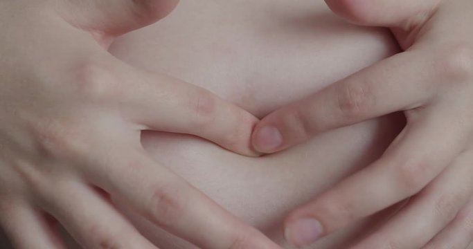 Pregnant Woman Strokes Tummy
