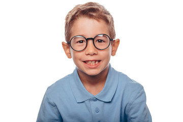 cucasian boy ajusting his eyeglasses and looking at camera over white background. Concept new eyeglasses for good vision