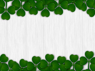 Green shamrock leaves decorated on wooden texture background for St. Patrick's Day celebration template design.