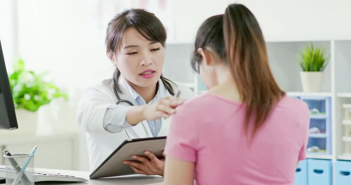 woman doctor and patient discussing
