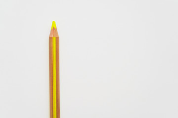 Yellow wooden pencil on white background