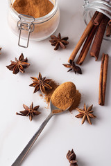 ground cinnamon, cinnamon sticks, star anise top view.