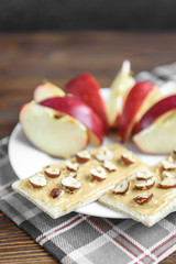 Rye crispbread, homemade peanut butter and red apple