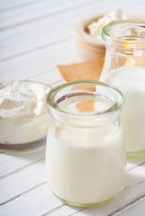 milk samples on white wood table
