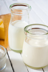 milk samples on white wood table