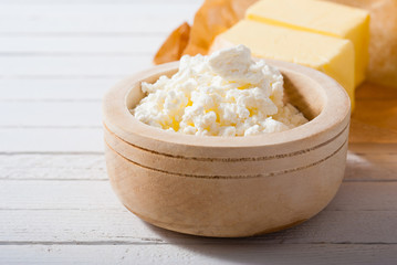 homemade dairy product samples on white wood table background