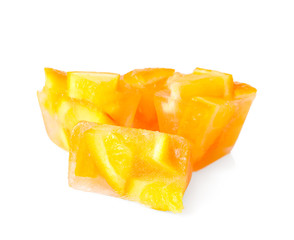 Ice cubes with orange slices on white background
