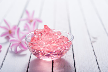 anti aging gel and hyacinth flowers on white wood