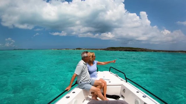 Carefree retired couple having yacht trip outdoor Bahamas