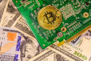 Bitcoin and circuit board on the one hundred dollar bills