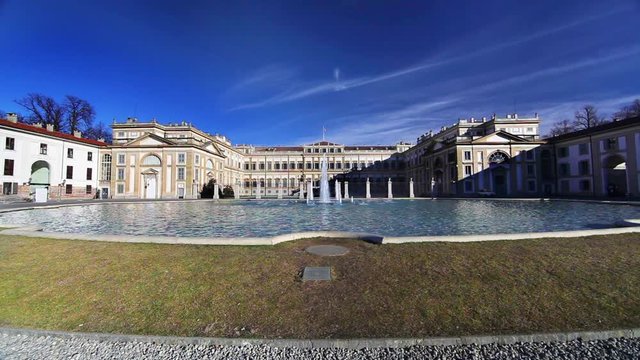 Fountain pouring water and ancient royal palace of villa reale monza