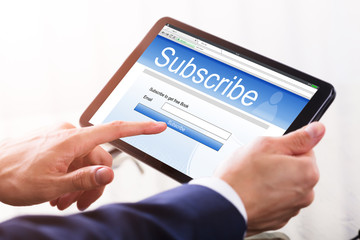 Businessperson Using Calendar On Digital Tablet