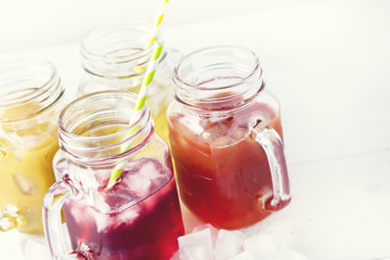 Variety of Tasty Juices in Glass Jars Mugs Healthy Beverages Drinks White Background Horizontal