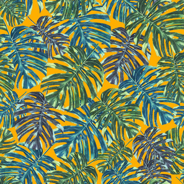 Seamless tropical monstera leaves and flowers pattern, jungle print design. Pattern on orange background. Fashion trended tropical background.