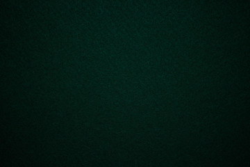 Dark green felt, felt texture with vignette