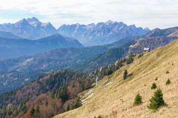 Obraz premium Panoramic view from mountain Golica in Karawanke with mountain hut in foreground, Slovenia