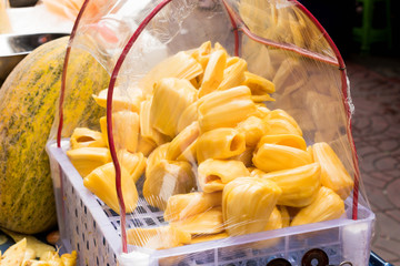 Closeup of yellow jackfruit in sale cart