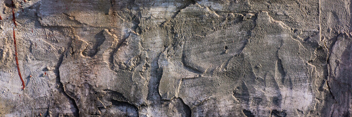 old cement plaster with traces of destruction. Web banner.