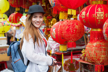 portrait of happy beautiful Young Asian women tourist traveler with backpack smiling in China town market culture