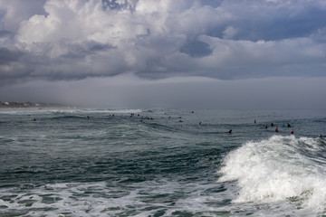 surfers riding waves 