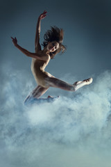 Dancing in cloud concept. Muscle brunette beauty female girl adult woman dancer athlete gymnast in...