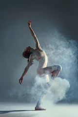 Tuinposter Dancing in cloud concept. Brunette beauty female girl adult woman dancer in dust / fog. Girl wearing dance clothing making dance element performance in flour, cloud on isolated grey / black background © Monstar Studio