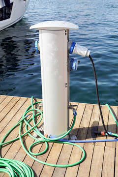 Shore Based Electricity Supply Appliance Power Supply And Battery Charged on the dock .