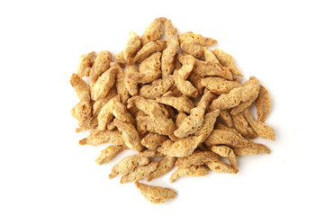 Raw soy chunks pile isolated on white background top view. Dry soya pieces meat used in vegetarian and vegan food.