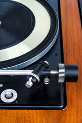 Side view of vintage turntable vinyl record player isolated on white