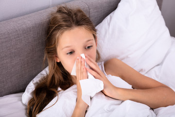 Girl Blowing Her Nose With Handkerchief