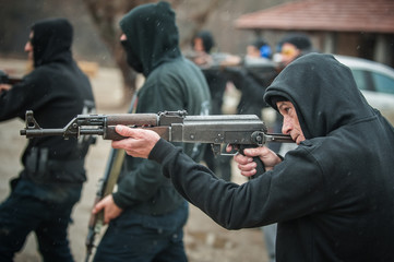 Large team action training with rifle machine gun. Shooting range
