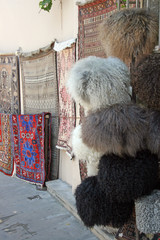 Caps and carpets / Sale of hats, traditional carpets on the market in Baku, Azerbaijan
