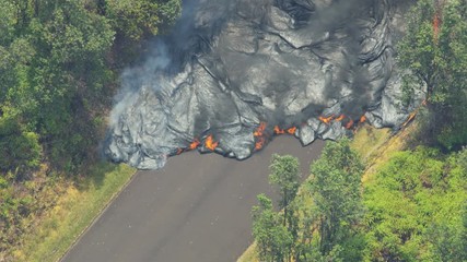 Aerial view volcanic lava cooling destroying roads property