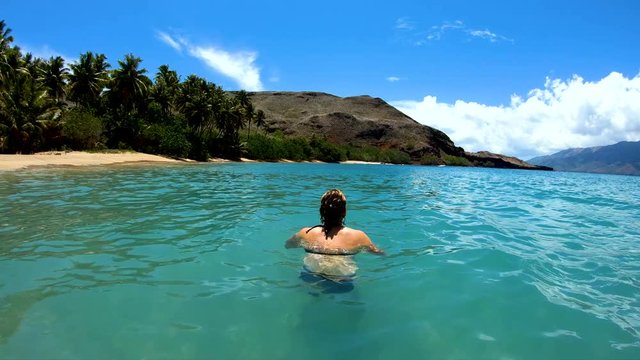 Tahuata Marquesas young female on deserted ocean beach
