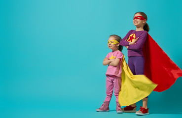 children playing superhero