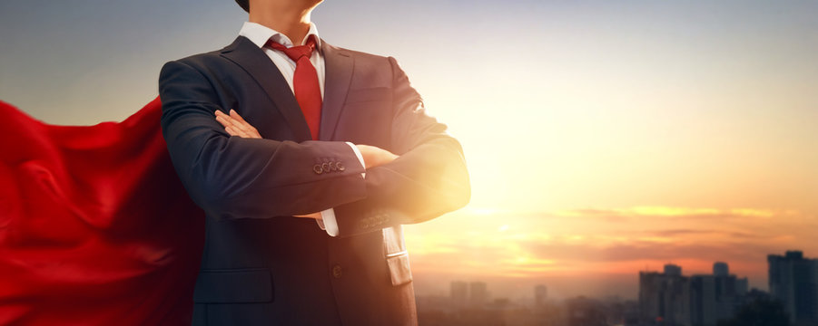 superhero businessman looking at city