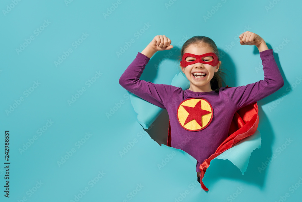 Wall mural child playing superhero