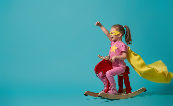 child playing superhero