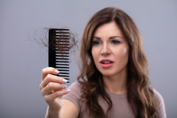 Worried Woman Suffering From Hairloss