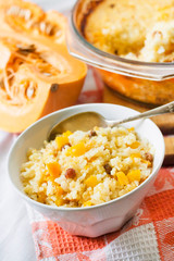 Milky cereal porridge with pumpkin and raisins