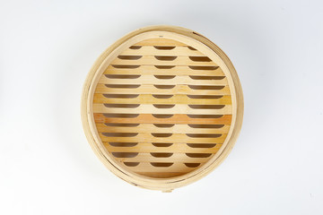 Wooden bamboo dim sum steamer on white background