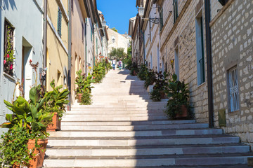 Fototapeta na wymiar Numana Sirolo Ancona Mount Conero Marche region Italy - The stairway of old town Numana, beautiful tiny pearl of the Adriatic Sea