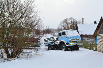 Old rusty track in winter day in village of Belarus
